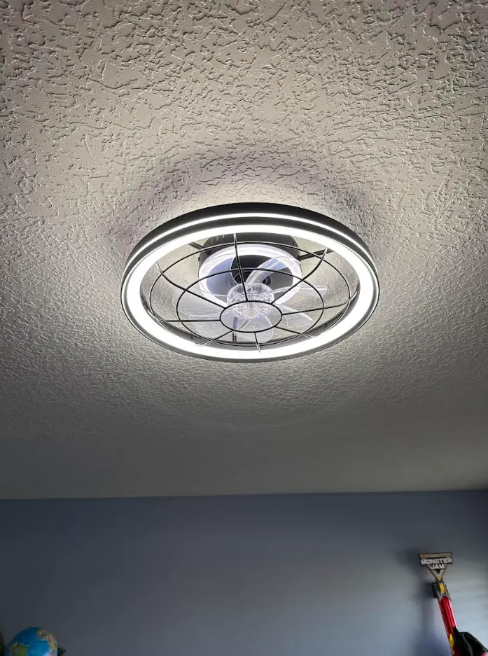A modern enclosed fan with an LED ring
